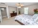 Comfortable bedroom with ceiling fan and views to the outside at 843 Christina Chase Dr, Lakeland, FL 33813