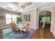 Bright dining room features decorative ceilings, a large table with seating, and easy access to the living area at 843 Christina Chase Dr, Lakeland, FL 33813