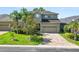 Lovely two-story home with a well-maintained lawn and a spacious two-car garage at 843 Christina Chase Dr, Lakeland, FL 33813