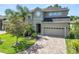 Charming two-story home featuring a paver driveway and well-manicured landscaping at 843 Christina Chase Dr, Lakeland, FL 33813