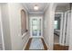 Foyer with decorative alcove, transom window, and glass-paneled front door at 843 Christina Chase Dr, Lakeland, FL 33813
