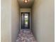 Covered entryway featuring a decorative front door with glass panels and brick pavers at 843 Christina Chase Dr, Lakeland, FL 33813