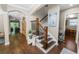 Inviting hallway features hardwood floors, with an staircase, and easy access to other rooms in the home at 843 Christina Chase Dr, Lakeland, FL 33813