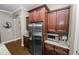 Gourmet kitchen with stainless steel appliances, rich wood cabinetry, and granite countertops at 843 Christina Chase Dr, Lakeland, FL 33813
