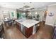 Stylish kitchen island with stainless steel appliances, pendant lighting, and comfortable seating at 843 Christina Chase Dr, Lakeland, FL 33813