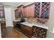 Beautiful kitchen with custom cabinetry, granite countertops, a microwave, and a wine rack at 843 Christina Chase Dr, Lakeland, FL 33813