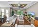 Open-concept living room featuring hardwood floors, natural light, and seamless transitions to the outdoor patio area at 843 Christina Chase Dr, Lakeland, FL 33813