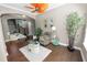 Relaxing living room features modern ceiling fan, hardwood floors, and natural light, creating a peaceful ambiance at 843 Christina Chase Dr, Lakeland, FL 33813