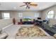 A roomy upper-level entertainment space has a ceiling fan and includes an office area and fitness equipment at 843 Christina Chase Dr, Lakeland, FL 33813