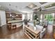Open-concept living room and kitchen area with hardwood floors and ample natural light at 843 Christina Chase Dr, Lakeland, FL 33813