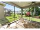 Charming screened patio with brick flooring and a dining set, ideal for entertaining guests outdoors at 843 Christina Chase Dr, Lakeland, FL 33813