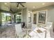 Expansive screened patio featuring brick flooring, a ceiling fan, and comfortable seating arrangements at 843 Christina Chase Dr, Lakeland, FL 33813