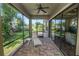 Screened patio with a chaise lounge and views of the landscaped backyard at 843 Christina Chase Dr, Lakeland, FL 33813