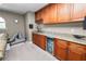 A convenient wet bar features granite counters, wood cabinetry, and a beverage refrigerator at 843 Christina Chase Dr, Lakeland, FL 33813