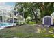 Beautiful backyard featuring a pool, storage shed and plenty of space at 8760 Plantation Ridge Blvd, Lakeland, FL 33809