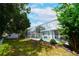 Lush backyard featuring a screened-in pool, privacy fencing, and beautiful landscaping at 8760 Plantation Ridge Blvd, Lakeland, FL 33809