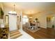 Inviting entryway leading to a dining area with neutral decor and wood-look floors at 8760 Plantation Ridge Blvd, Lakeland, FL 33809