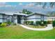 Charming single-story home with a well-manicured lawn, welcoming walkway, and attractive curb appeal at 8760 Plantation Ridge Blvd, Lakeland, FL 33809