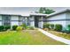 Inviting single-story home featuring manicured landscaping, a walkway, and charming curb appeal at 8760 Plantation Ridge Blvd, Lakeland, FL 33809