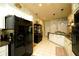 Bright and airy kitchen featuring modern appliances and ample storage space near a pantry at 8760 Plantation Ridge Blvd, Lakeland, FL 33809