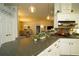 Well-equipped kitchen with pantry, granite countertops, and seamless flow into dining and living spaces at 8760 Plantation Ridge Blvd, Lakeland, FL 33809