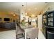 Charming kitchen boasts white cabinets, stylish pendant lighting, and an open layout for entertaining at 8760 Plantation Ridge Blvd, Lakeland, FL 33809
