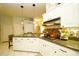 Beautiful kitchen with island seating, modern appliances, and granite countertops opens to dining area at 8760 Plantation Ridge Blvd, Lakeland, FL 33809