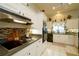 Stylish kitchen featuring modern appliances, tile backsplash, and ample counter space for cooking at 8760 Plantation Ridge Blvd, Lakeland, FL 33809