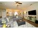 Spacious living room with large sectional sofa, open to dining room and kitchen at 8760 Plantation Ridge Blvd, Lakeland, FL 33809