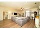 Spacious living room featuring wood floors and large comfortable sofa, perfect for relaxing at 8760 Plantation Ridge Blvd, Lakeland, FL 33809
