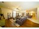 Open-concept living area featuring wood floors and comfortable seating, great for entertaining at 8760 Plantation Ridge Blvd, Lakeland, FL 33809