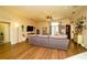 Cozy living room showcasing wood floors and large sofa, ideal for Gathering time at 8760 Plantation Ridge Blvd, Lakeland, FL 33809