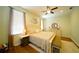 Bright main bedroom featuring hardwood floors, neutral walls, and stylish furniture at 8760 Plantation Ridge Blvd, Lakeland, FL 33809