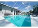 Sparkling pool with screened enclosure, lounge chairs, and an inviting outdoor space at 8760 Plantation Ridge Blvd, Lakeland, FL 33809