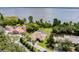 Stunning aerial view showcasing the estate on a lakefront lot surrounded by lush landscaping at 9093 S Bay Dr, Haines City, FL 33844