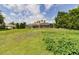 Large backyard featuring a screened lanai with plenty of room for outdoor activities and entertainment at 9093 S Bay Dr, Haines City, FL 33844