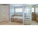 Bright bathroom featuring a soaking tub with marble surround and a glass block shower at 9093 S Bay Dr, Haines City, FL 33844