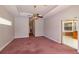 Bright bedroom with tray ceilings, fan and sliding doors to outside at 9093 S Bay Dr, Haines City, FL 33844