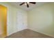Bedroom featuring neutral walls, a closet, and a ceiling fan at 9093 S Bay Dr, Haines City, FL 33844