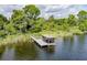 Overhead view of a well-maintained private dock, providing direct access to the tranquil lake at 9093 S Bay Dr, Haines City, FL 33844