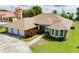 Lovely single-story home with a well-manicured lawn and three-car garage, offering ample space and curb appeal at 9093 S Bay Dr, Haines City, FL 33844