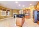 Kitchen with island, fireplace, and view to other rooms at 9093 S Bay Dr, Haines City, FL 33844