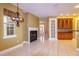 Open-concept living room featuring fireplace and light-filled windows at 9093 S Bay Dr, Haines City, FL 33844