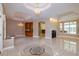 Spacious living area with tile floors, a fireplace, wet bar, and plenty of natural light at 9093 S Bay Dr, Haines City, FL 33844