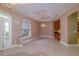 Bright living room featuring front entry way and built-in bar area at 9093 S Bay Dr, Haines City, FL 33844