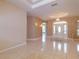 Bright living room featuring front entryway and view to other rooms at 9093 S Bay Dr, Haines City, FL 33844