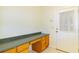 Mudroom featuring a long counterspace with cabinets and exterior door at 9093 S Bay Dr, Haines City, FL 33844