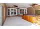 Covered patio with tiled floor, hot tub, bay windows, and ceiling fans, perfect for relaxation at 9093 S Bay Dr, Haines City, FL 33844