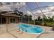 Relaxing pool with screened enclosure and ample area for outdoor lounging and leisure at 9093 S Bay Dr, Haines City, FL 33844