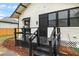 Charming back porch area with black-painted stairs and railings at 911 S Missouri Ave, Lakeland, FL 33803